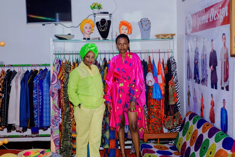 Olga Nganzi Samba-Panza (L), founder of Ou2019Poma Designs during the opening of her shop .