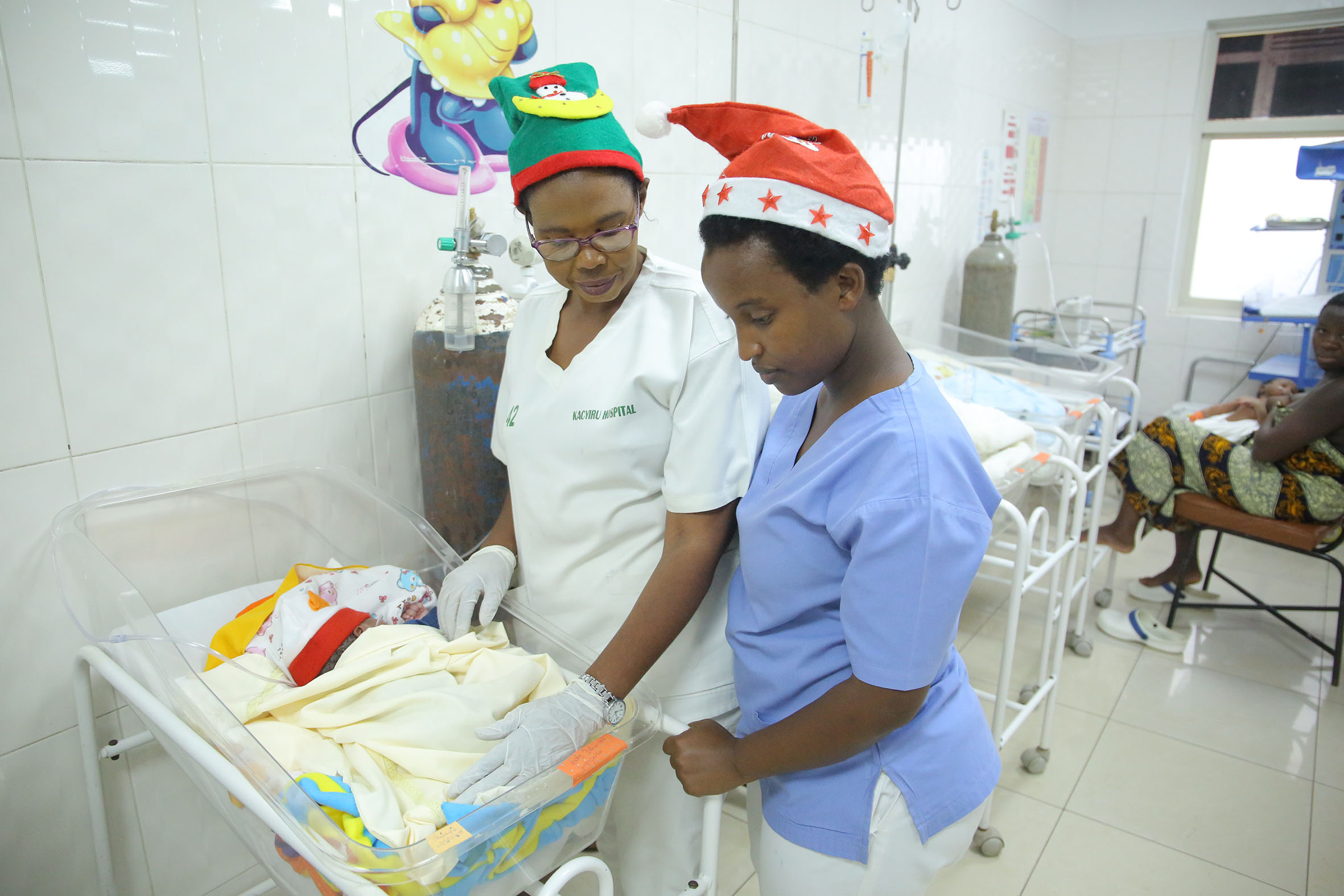 Nurses take care of a newborn at Kacyiru Hospital.The Rwandan Law Governing Persons and Families stipulates that the mode of reproduction in Rwanda is naturally between a man and a woman or it can be medically assisted. Photo: Sam Ngendahimana.