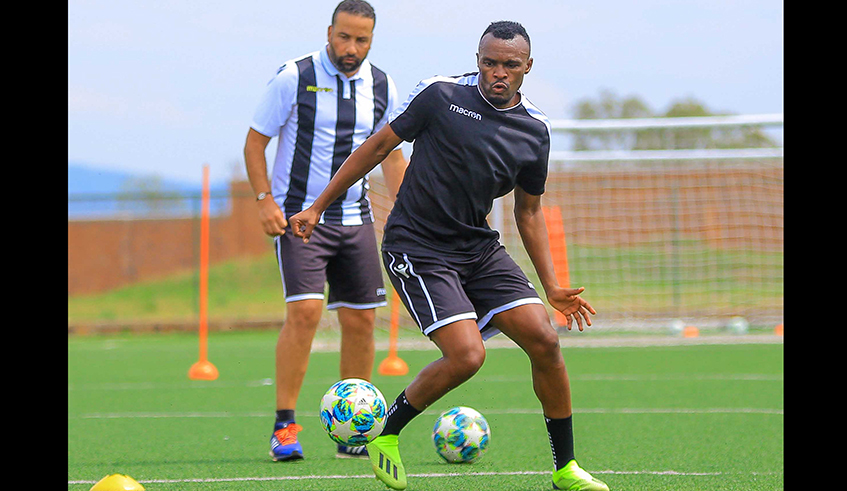 APR skipper Jacques Tuyisenge and head coach Adil Erradi (in background) have traded words for sabotaging each other this season, and Tuyisenge is likely to be released in the coming months. Photo: Courtesy.