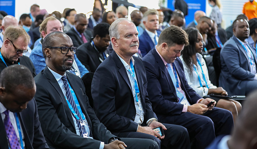 Delegates follow a panel discussion on u201cBridging the Digital Divideu201d as part of the Commonwealth Business Forum. Dan Nsengiyumva