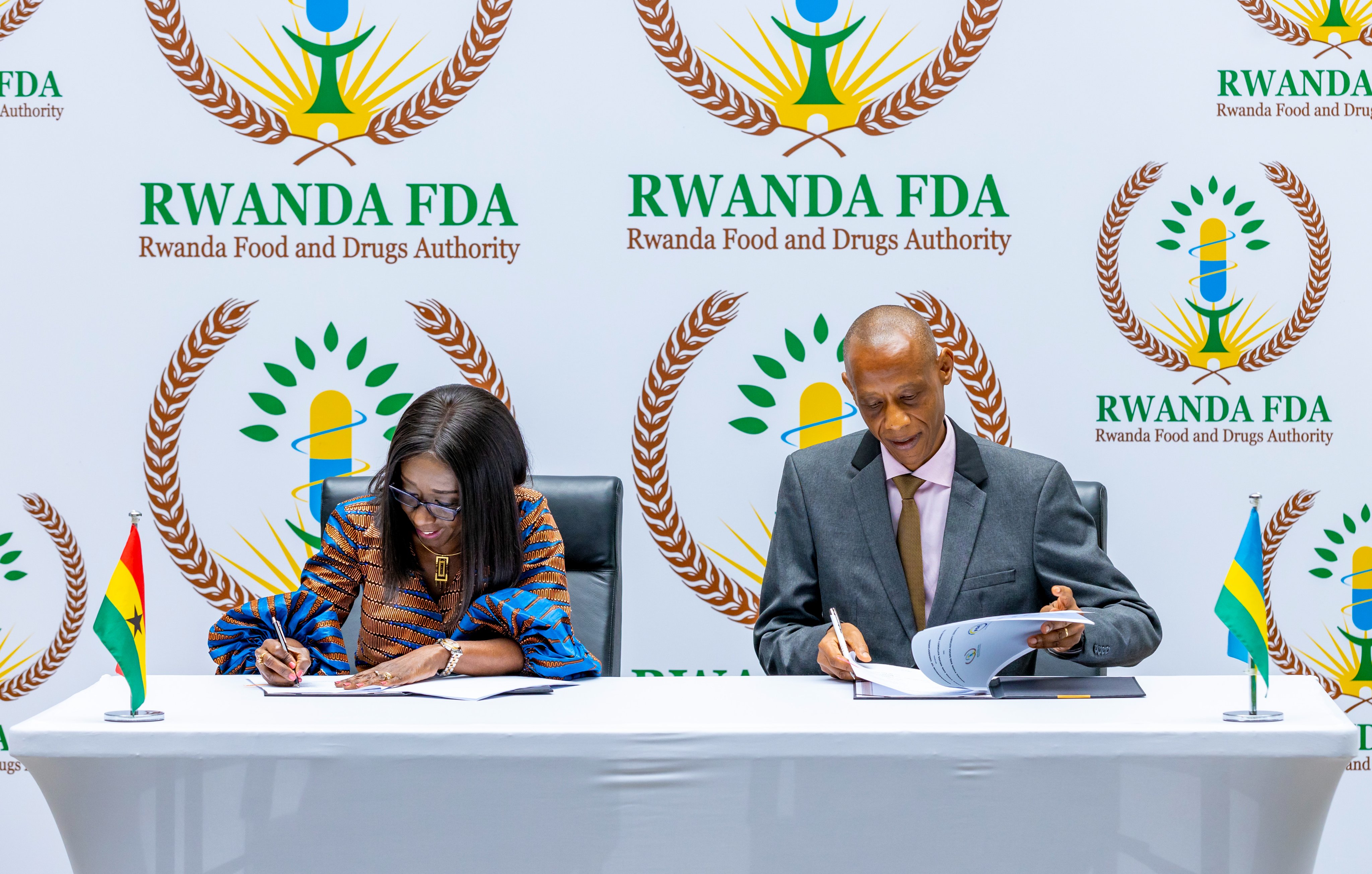 Director-General of Rwanda FDA, Dr. Emile Bienvenu, and Delese Mimi Darko, Chief Executive Officer of Ghana FDA sign the agreement in Kigali on June 24.