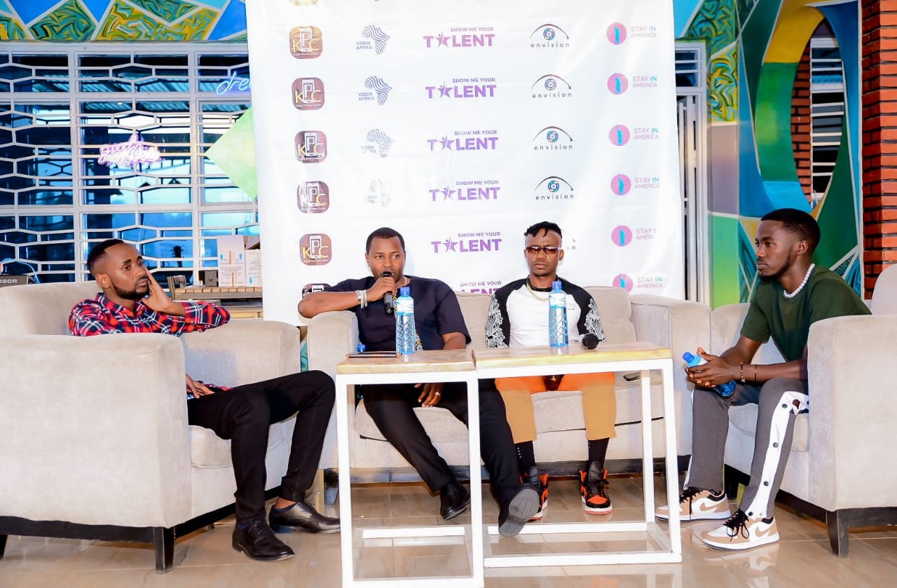 Contestants with Lucky Nzeyimana and Mani Martin (center) on a TV show. 