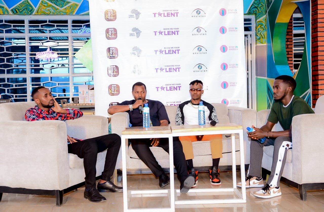 Contestants with Lucky Nzeyimana and Mani Martin (center) on a TV show. 
