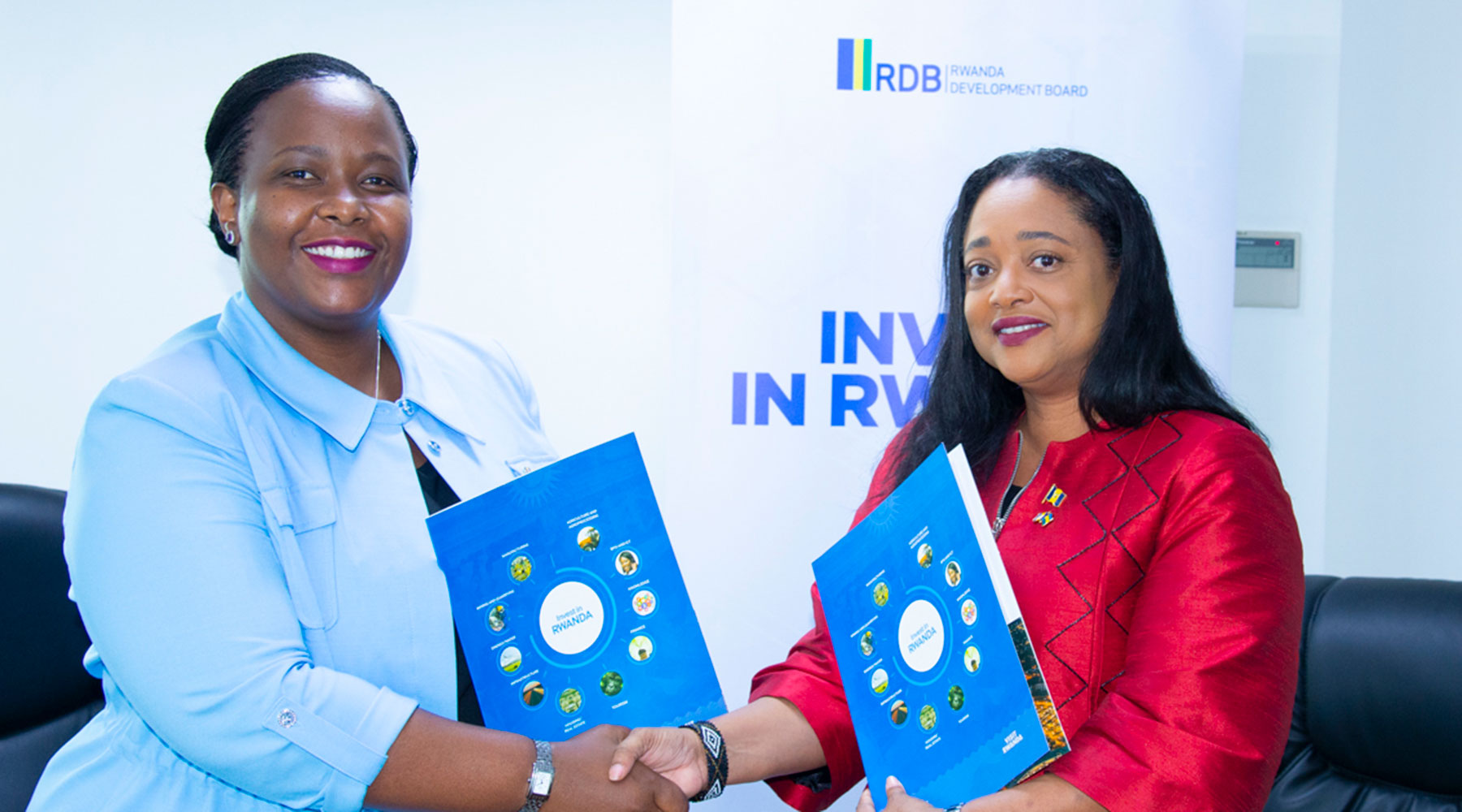 Clare Akamanzi, Rwanda Development Board Chief Executive (left), and Kaye-Anne Greenidge, Chief Executive of Barbados International Business Promotion Corporation, shake hands during the signing ceremony in Kigali on June 24. The agreement seeks to promote and implement strategic private sector investments in both countries. 
