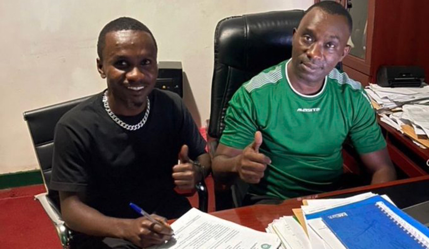 Kiyovu defender Ali Serumogo signs a new deal on Monday. Alongside him is the club president, Juvenal Mvukiyehe. / courtesy 