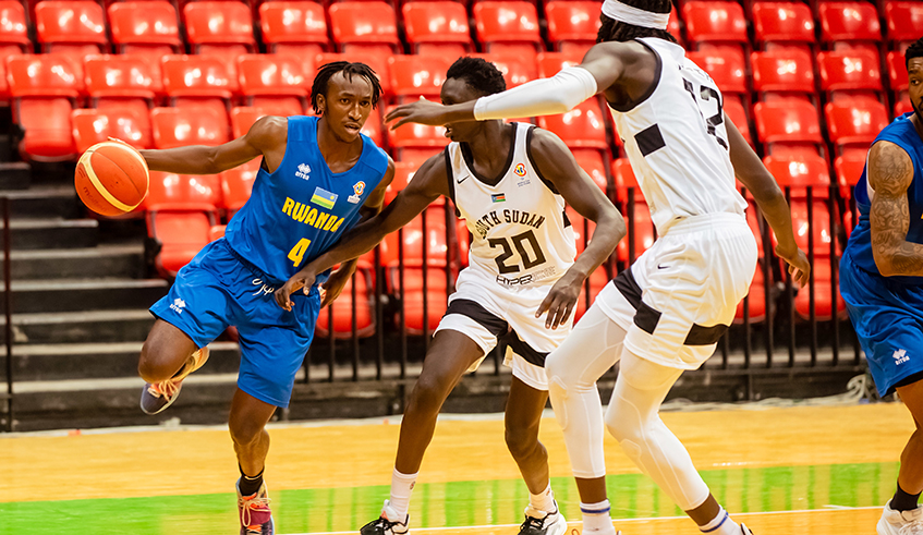 Wilson Nshobozwabyosenumukiza with the ball during a past game against South Sudan. Rwanda will be taking on South Sudan on Friday as the second window of the FIBA World Cup qualifiers tips off. Photo: File