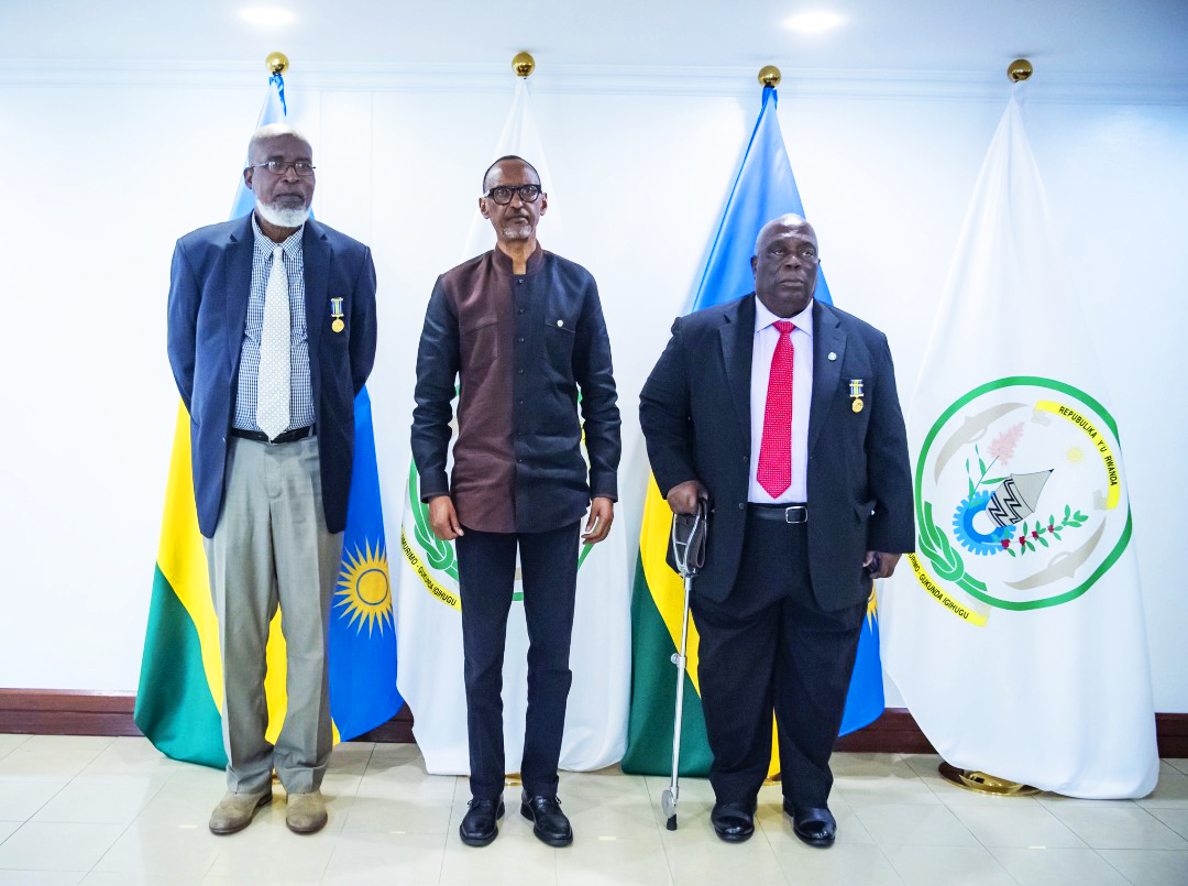 President Paul Kagame has conferred the National Order of Bravery  to Maj. Gen (rtd) Henry Nkwame Anyidoho (Left) and Maj. Gen. (rtd) Joseph Narh Adinkra (Right) for their decision to stay back and save people during the 1994 Genocide against the Tutsi,in Kigali on July 4. Photo by Village Urugwiro