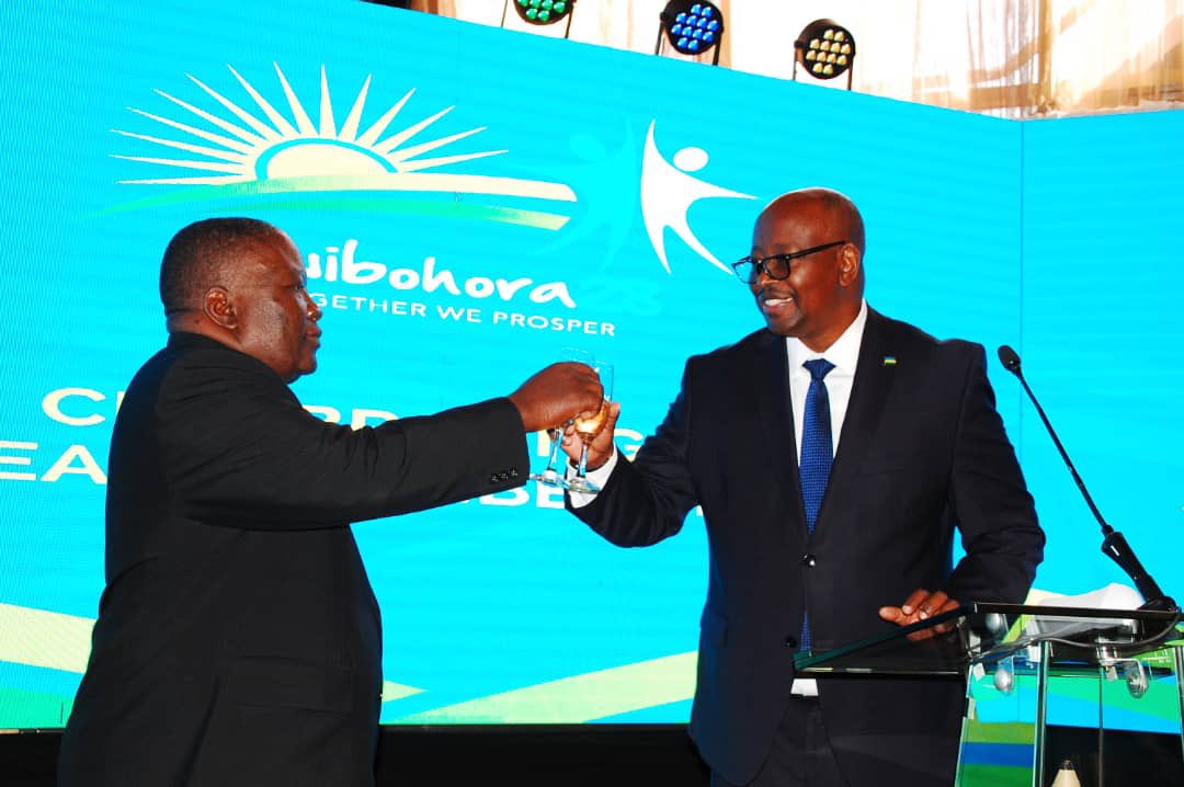 Rwandau2019s envoy to Zimbabwe James Musoni (right) makes a toast with Chief Director, Multilateral Affairs and SADC Focal Point at Zimbabweu2019s Foreign Affairs ministry, Amb. Raphael Tayerera Faranisi, on the occasion of Rwandau2019s Liberation Day, in Harare on July 4.