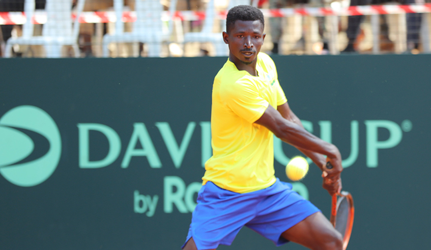 Ernest Habiyambere. who plies his trade in Kenya, prepares to play the ball as he beat Tanzaniau2019s Omari Harris Sulle on Wednesday at the Ecology Tennis Club at IPRC-Kigali. Photo: Courtesy.