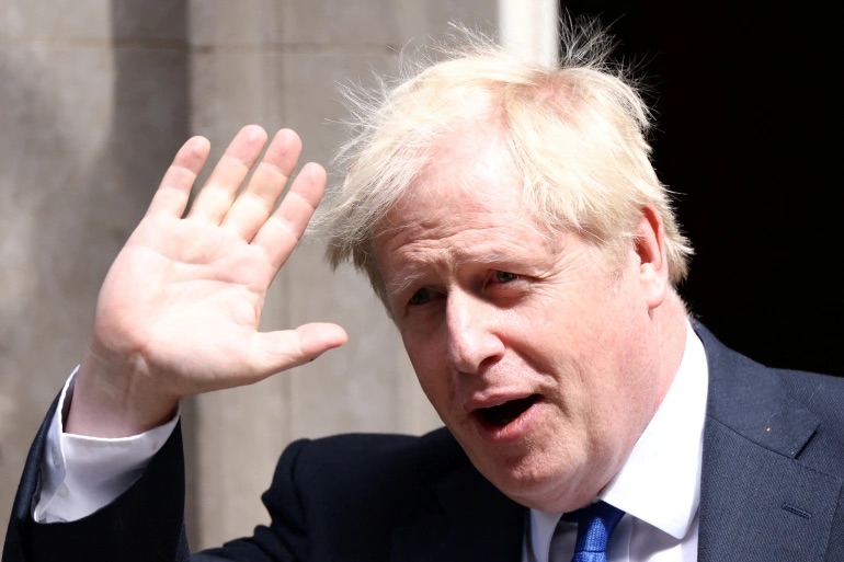British Prime Minister Boris Johnson walks at Downing Street in London, Britain. 