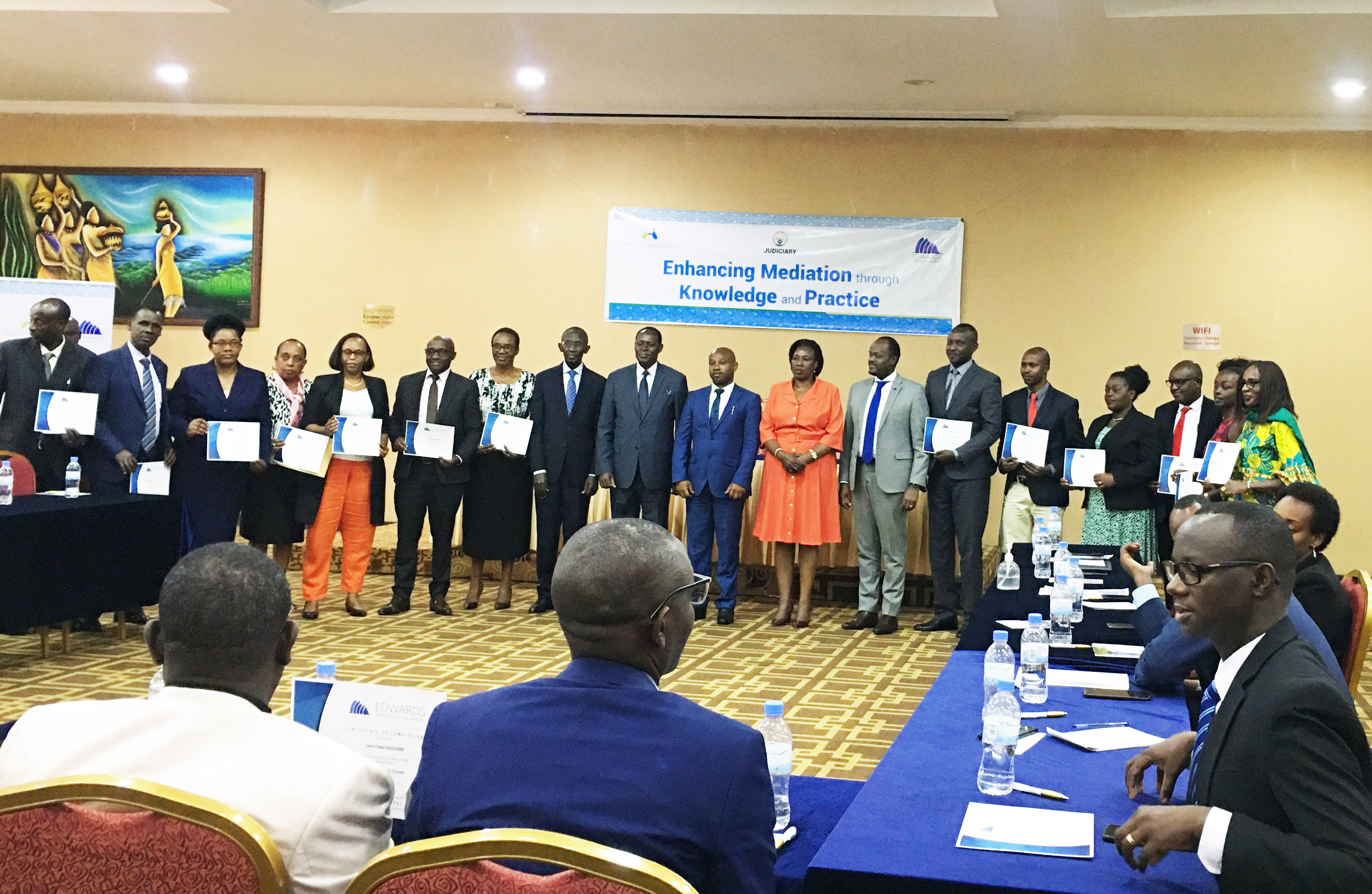 Officials pose for a photo with some of the 96 mediators certified by the Supreme Court after completing a 6-month course in professional mediation in Kigali on July 6. 