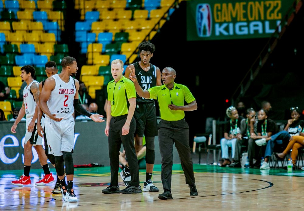 Jean Sauveur Ruhamiriza (R) refereed the quarter-final game between Egyptian giants Zamalek and SLAC of Guinea during the 2022 Basketball Africa League (BAL) playoffs in Kigali in May. / Photo: File