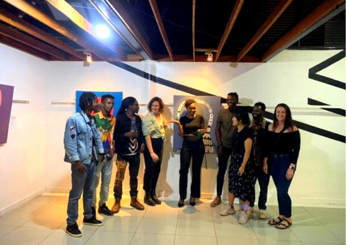 Myriam Uwiragiye Birara with different people who attended the opening of her exhibition