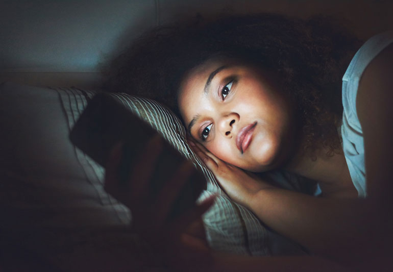 Studies have shown that the blue light emitted by your smartphone is bad for your vision but it can be bad for your sleep, too. Photo: Net
