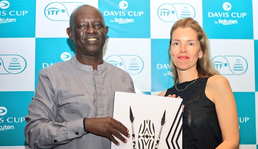 ITF Event Manager Delphine Lemesle (right) receives a gift from Rwanda Tennis Federation president Theoneste Karenzi after the final of the Davis Cup tournament. Photo: Courtesy.