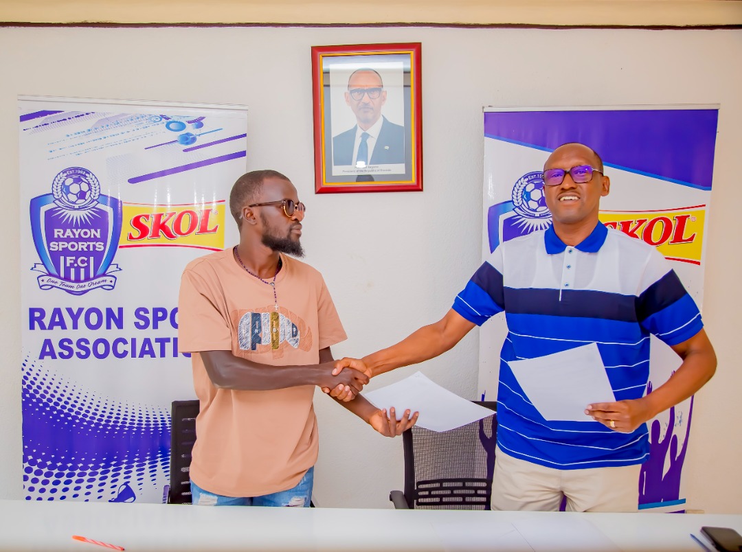Rayon Sport President Jean Fideu0300le Uwayezu (R) shakes hands with Felix Ndekwe after he signed a deal with the club from AS Kigali last week. The club has so far signed eight players. / Courtesy