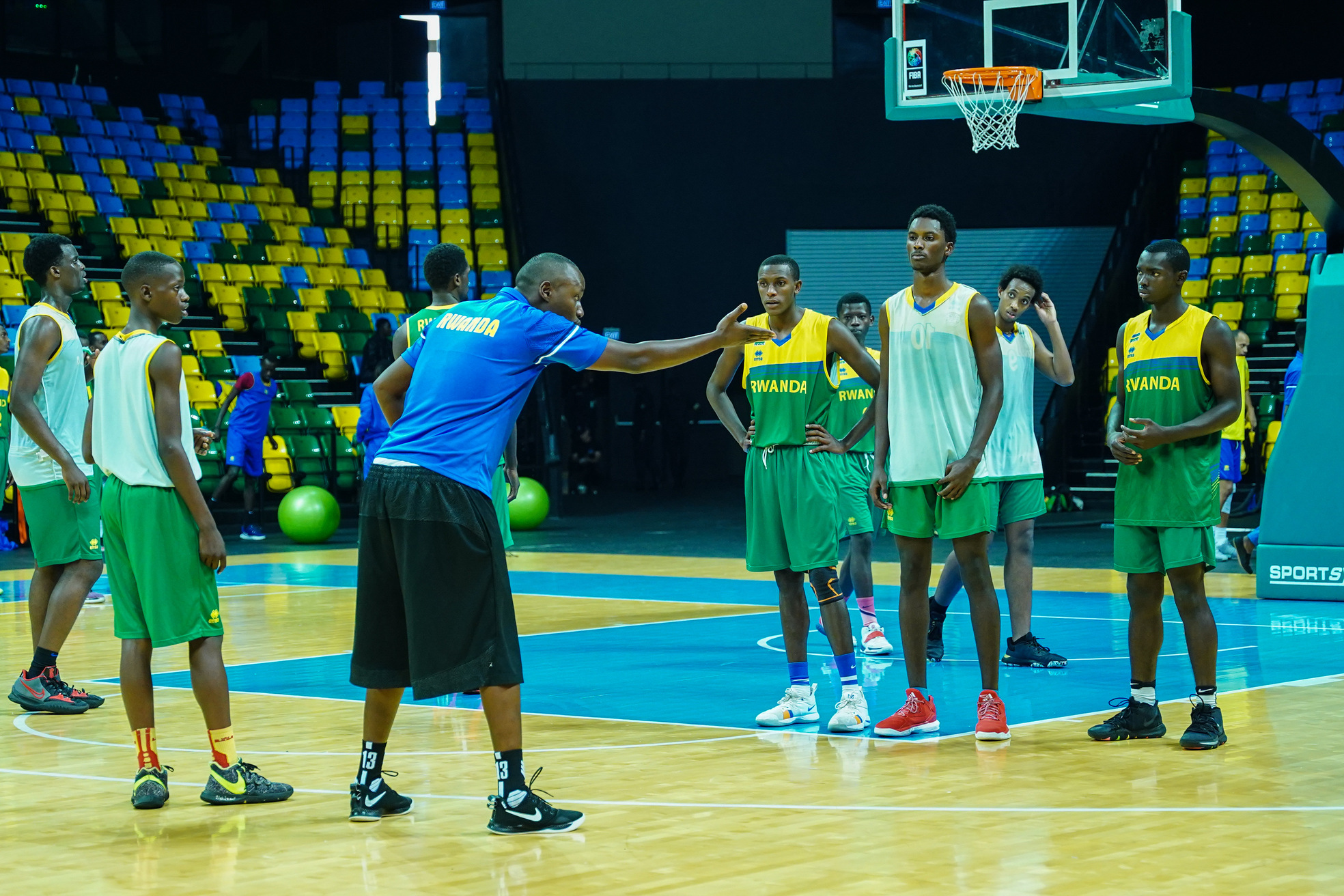 U-18 boys' national basketball team follow the coach's instruction during a training session at BK Arena on June 7. Dan Nsengiyumva 