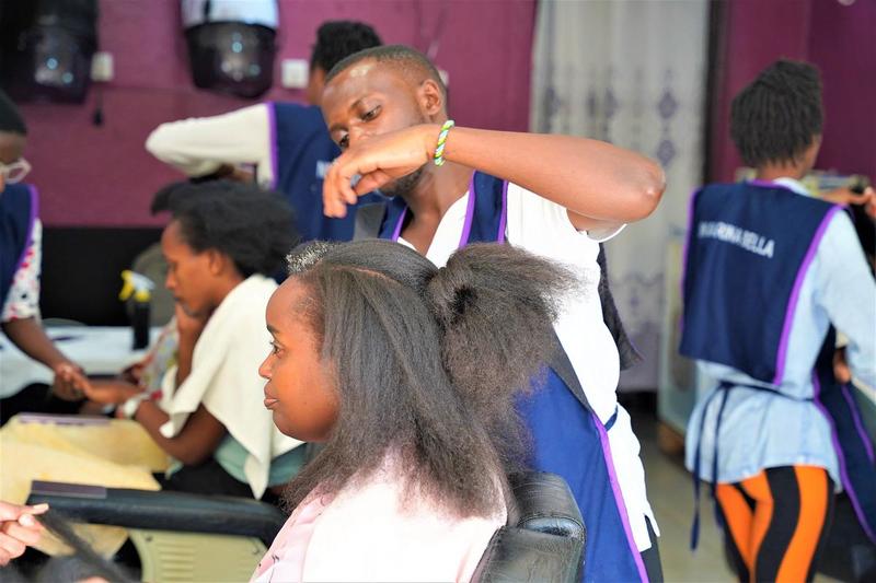 Clients at Marina Bella salon where natural hair dressing services are provided in Kigali. 