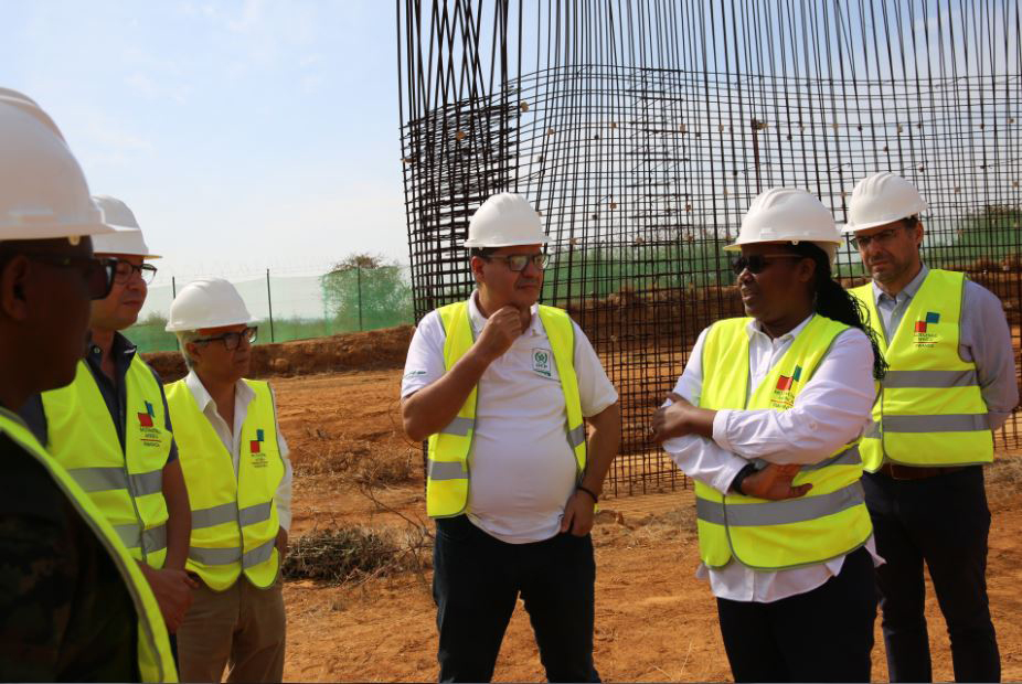 Agriculture minister Gu00e9rardine Mukeshimana (2nd right) chats with Mohamed Anouar Jamali, the CEO of OCP Africa (3rd right), during a visit at the site where the fertiliser blending facility is being set up in Bugesera District, on July 16. Photo: Courtesy.