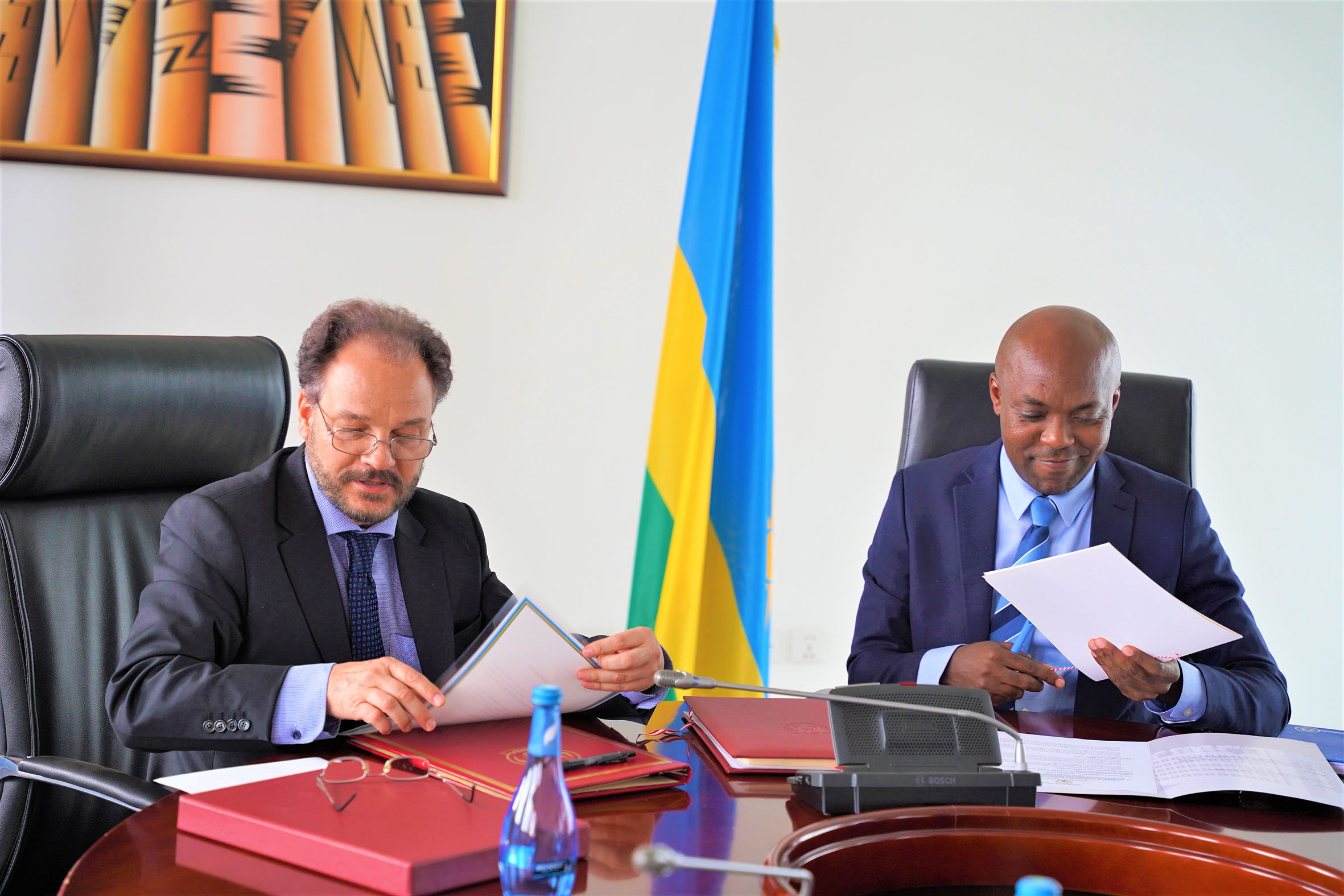 Christian Fellner, Austriau2019s Ambassador accredited to Rwanda (left), and Minister for Infrastructure Ernest Nsabimana sign the Bilateral Air Service agreements in Kigali on Tuesday, July 19. The agreement will see both countries opening skies for commercial airlines. / Photo: Craish Bahizi. 