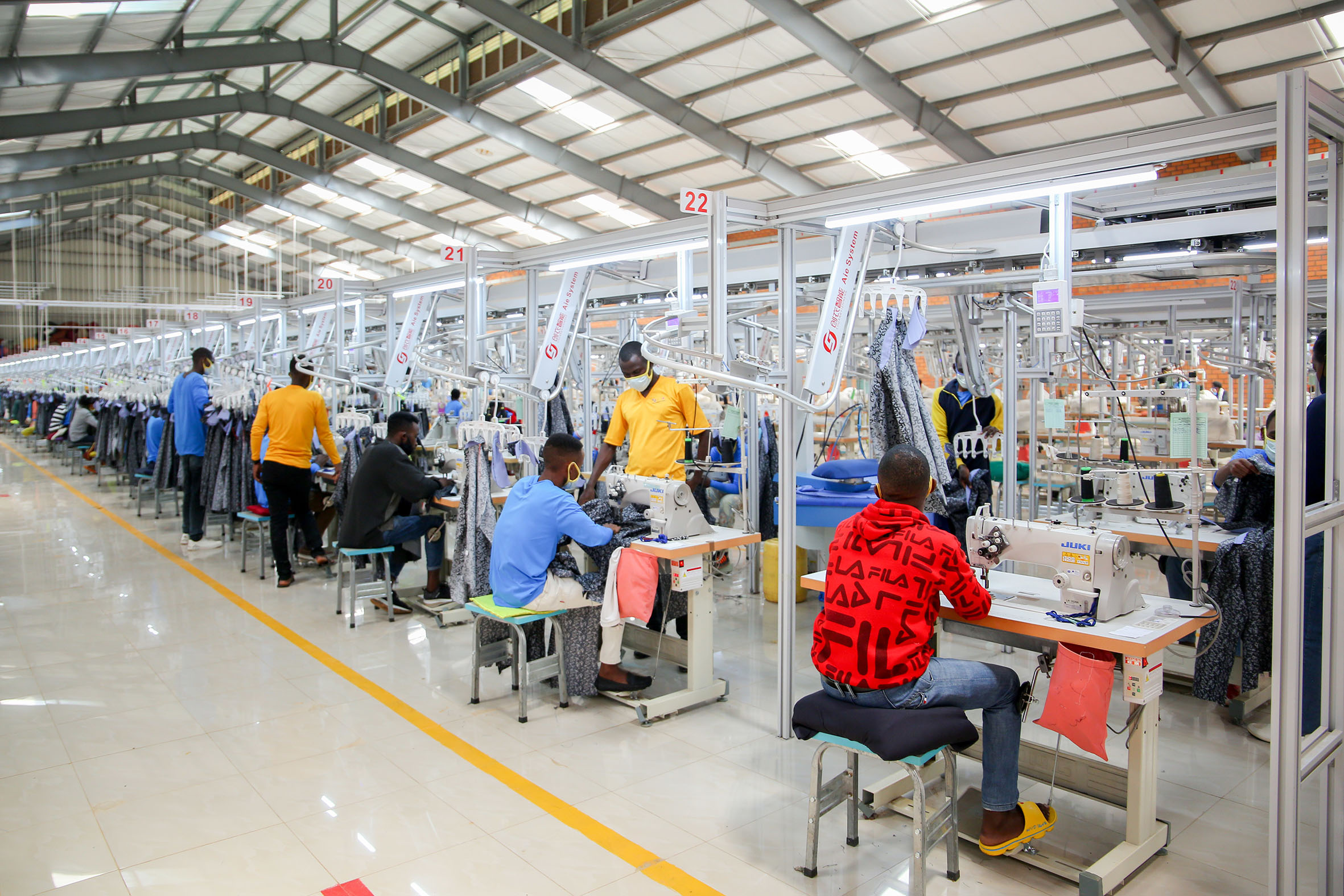 Trailors on duty at Pink Mango garment factory. A parliamentary report has pointed out some of the challenges that investors face in Rwanda, including expensive utilities like electricity, the cost of borrowing and taxes. Photo: Dan Nsengiyumva.