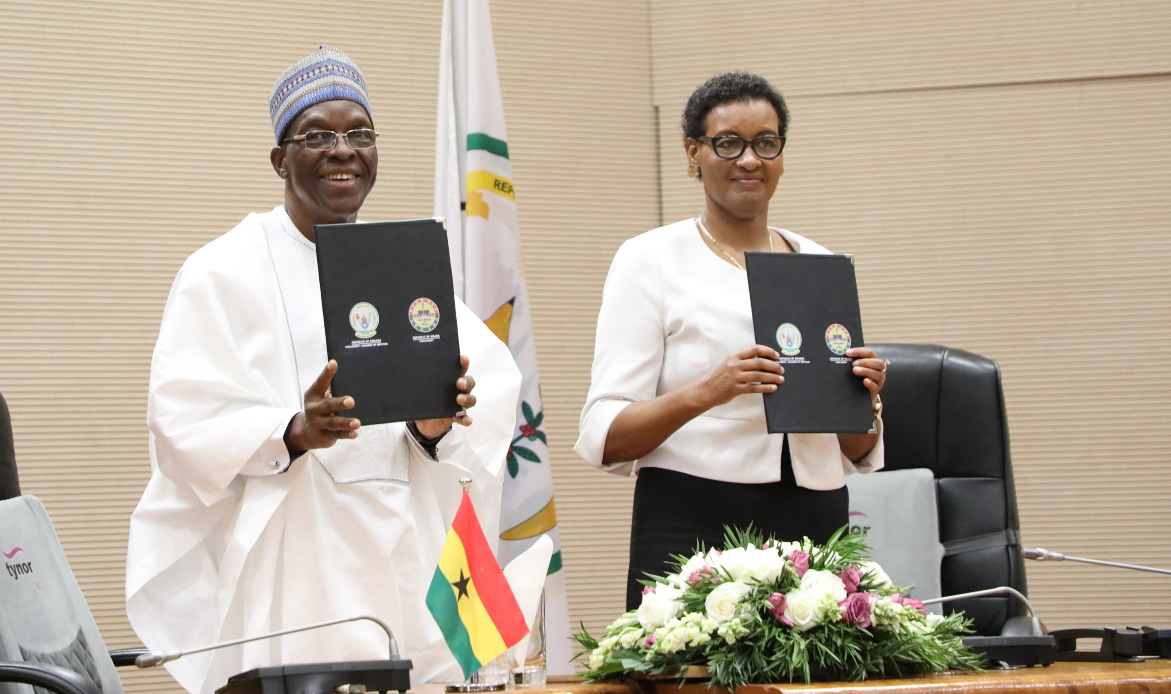 Speaker of the Parliament of Ghana,  Alban Sumana Kingsford Bagbin (left), and Speaker Donatille Mukabalisa, hold documents after signing the bilateral parliamentary cooperation agreement in Kigali on Wednesday, July 20. Under the signed agreement, the parties shall promote inter-parliamentary dialogue and contribute to enhancing friendly bilateral relations and ties between the peoples of Rwanda and Ghana. / Photo: Courtesy.  