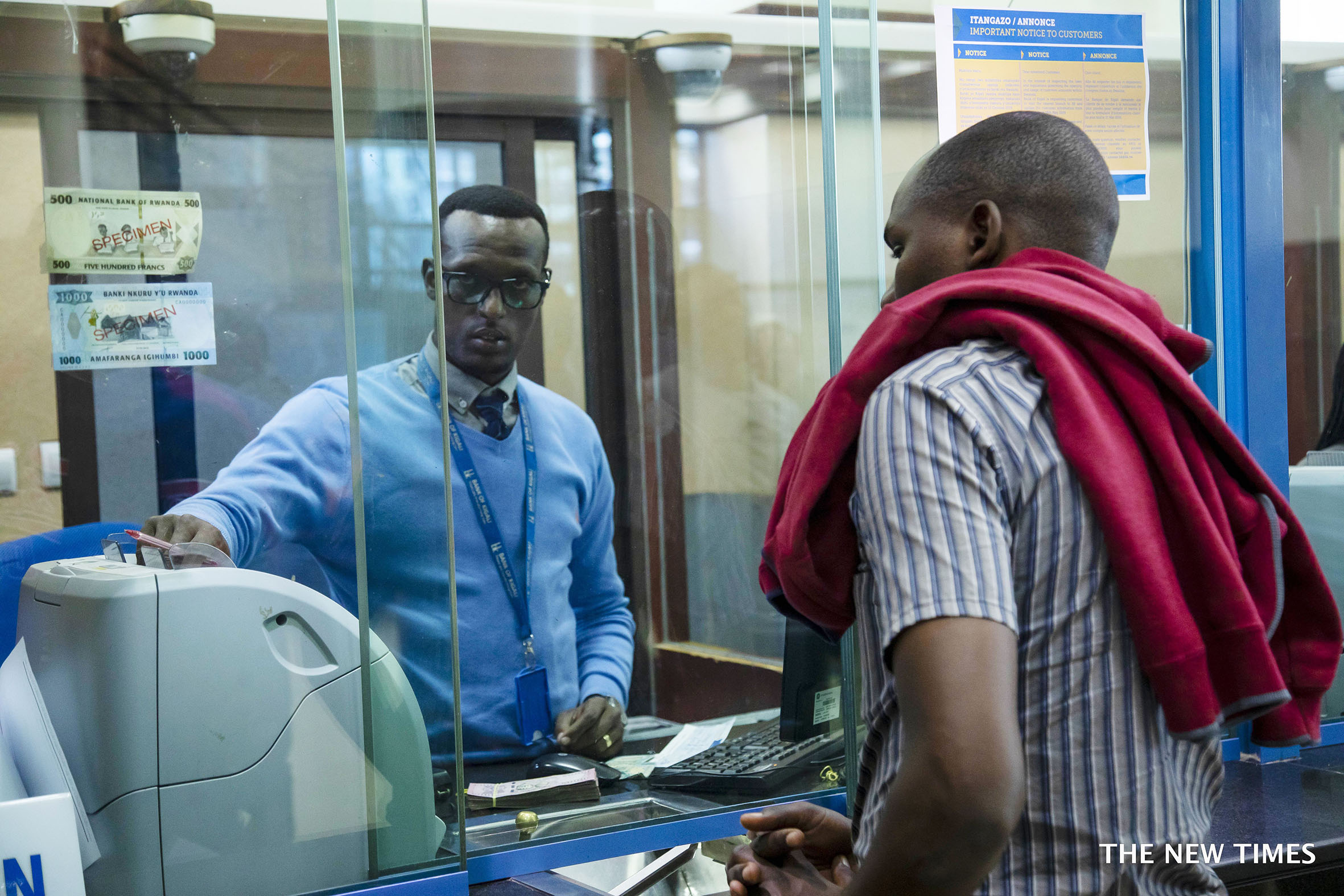 A teller serves a customer at Bank of Kigali main branch in Nyarugenge District. For the second time, the bank was recognised as u2018Best Bank in Rwandau2019 in the Euromoney Awards for Excellence 2022. Photo: File.