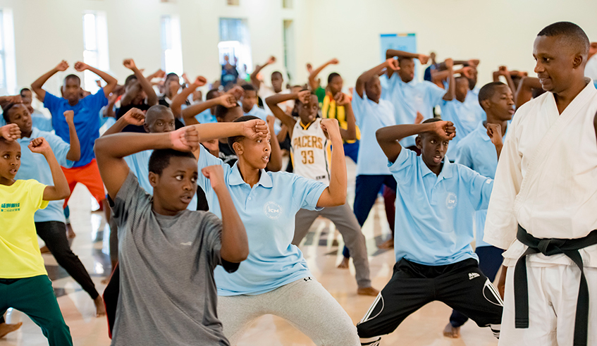 Youngsters demonstrate karate skills at the end of a five-week training, as an instructor looks on. Photo: Courtesy.