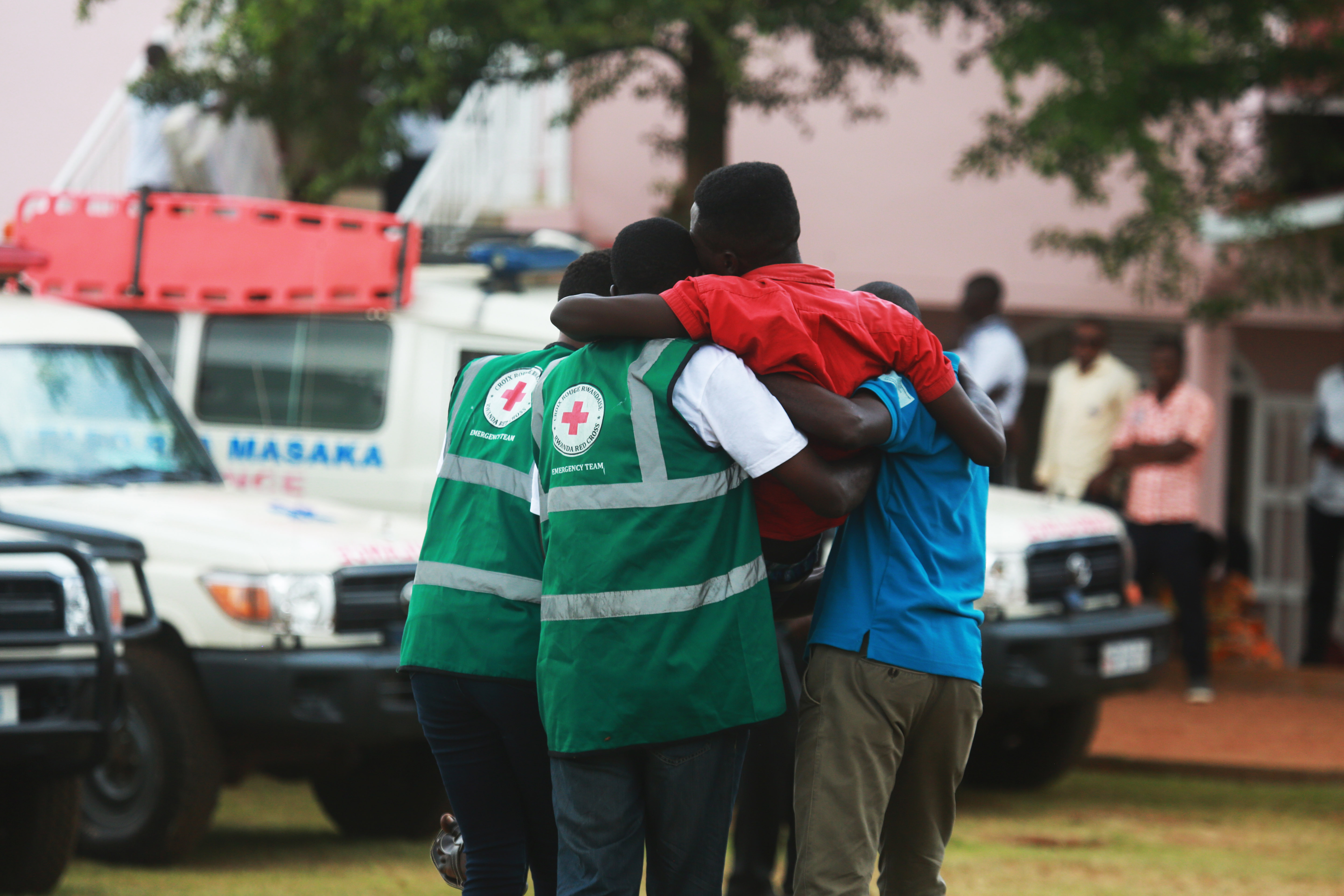 Volunteers help a trauma victim during a commemoration event at Kicukiro Nyanza Genocide Memorial on May 4, 2019. Youth gathered in Kigali to discuss and reflect on inter-generational trauma as a result of the 1994 Genocide against the Tutsi. . Photo by Sam Ngendahimana