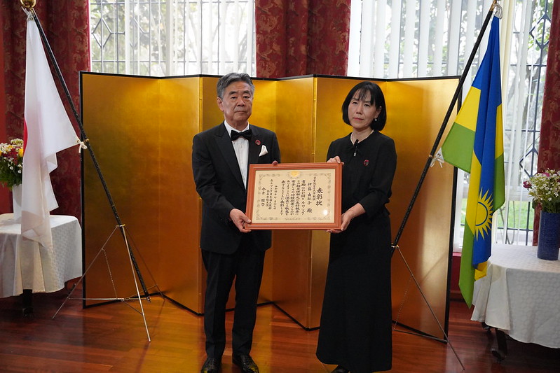 Ambassador Masahiro Imai hands over the award to one of five people who were recognized during the ceremony that took place at the Envoy of Japan in Rwandau2019s residence  on July 27. Photos by Craish Bahizi