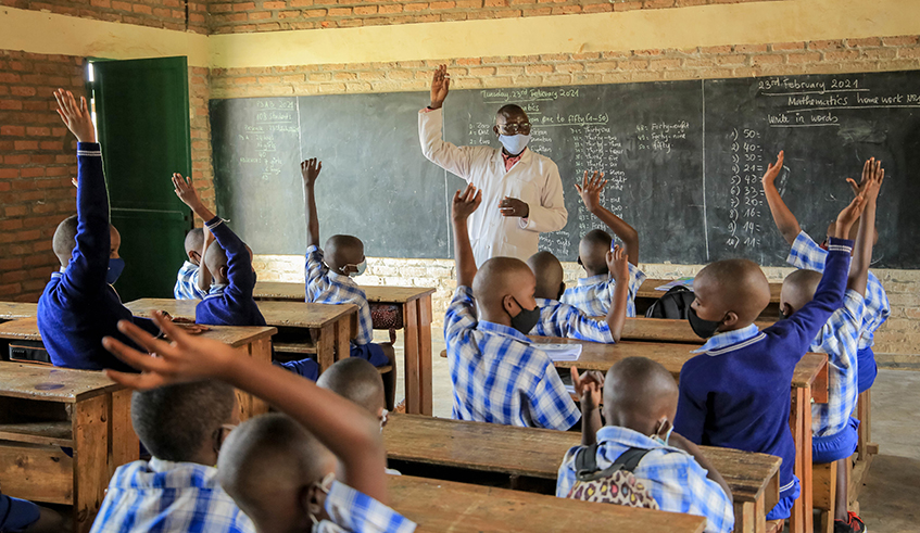 A primary school teacher during a class at Groupe Scolaire Remera Catholique.The government will  set equal  school fees countrywide in public school by the beginning of the academic year [2022-2023]. Photo by Dan Nsengiyumva