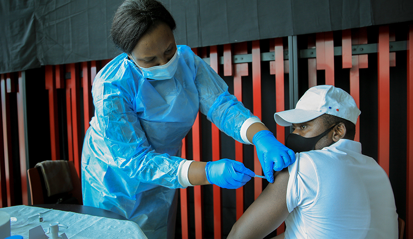 A health worker during a vaccination activity. Africa CDC initiative  aims to reach more than 700,000 citizens with the Covid-19 vaccine during the first year of its implementation. Dan Nsengiyumva