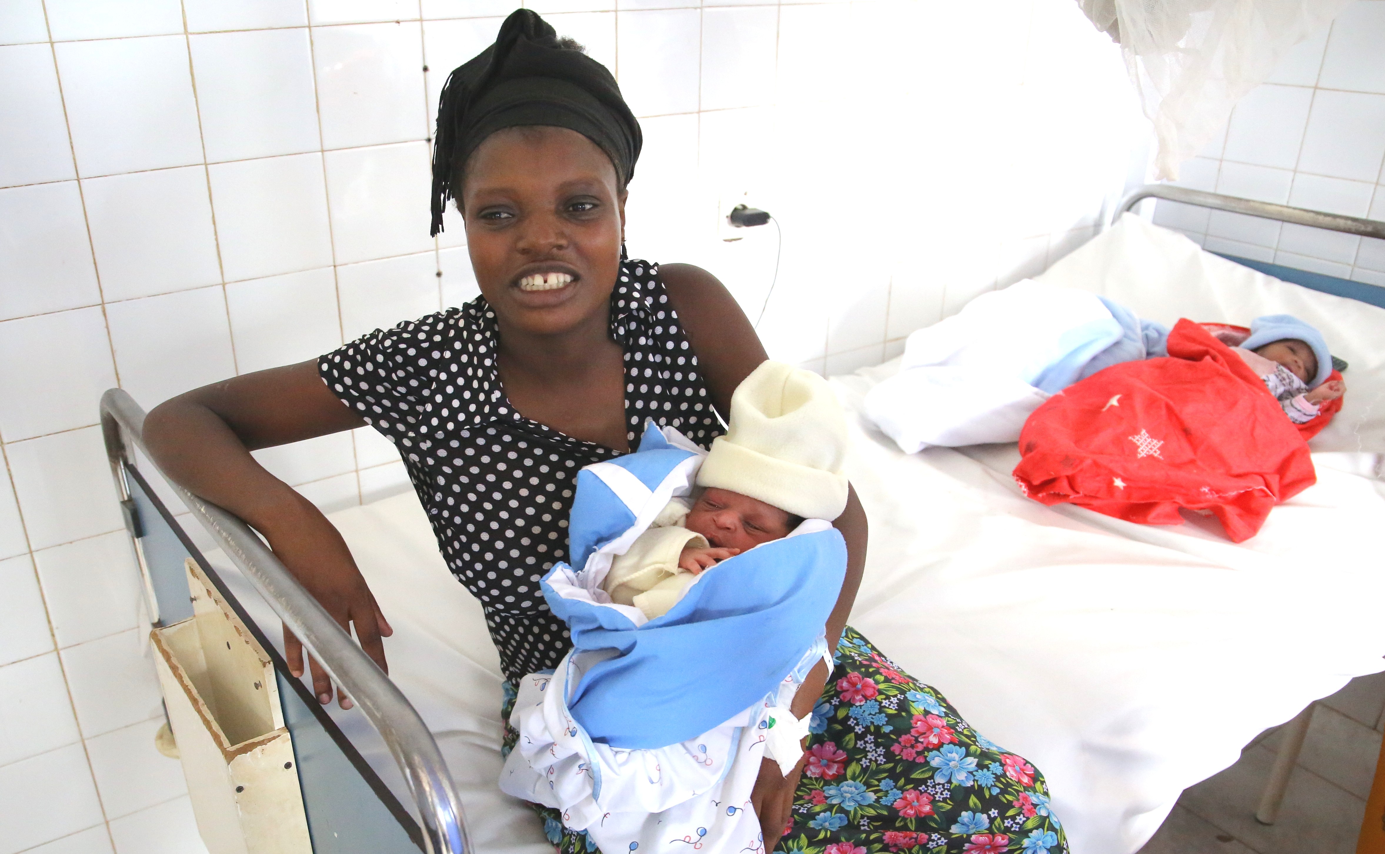 A mother with her new born at Kacyiru Hospital. National Institute of Statistics Rwandau2019s  2020 report indicates that timely registered births fell from 78 percent in 2019 to 72.3 percent in 2020. Craish Bahizi