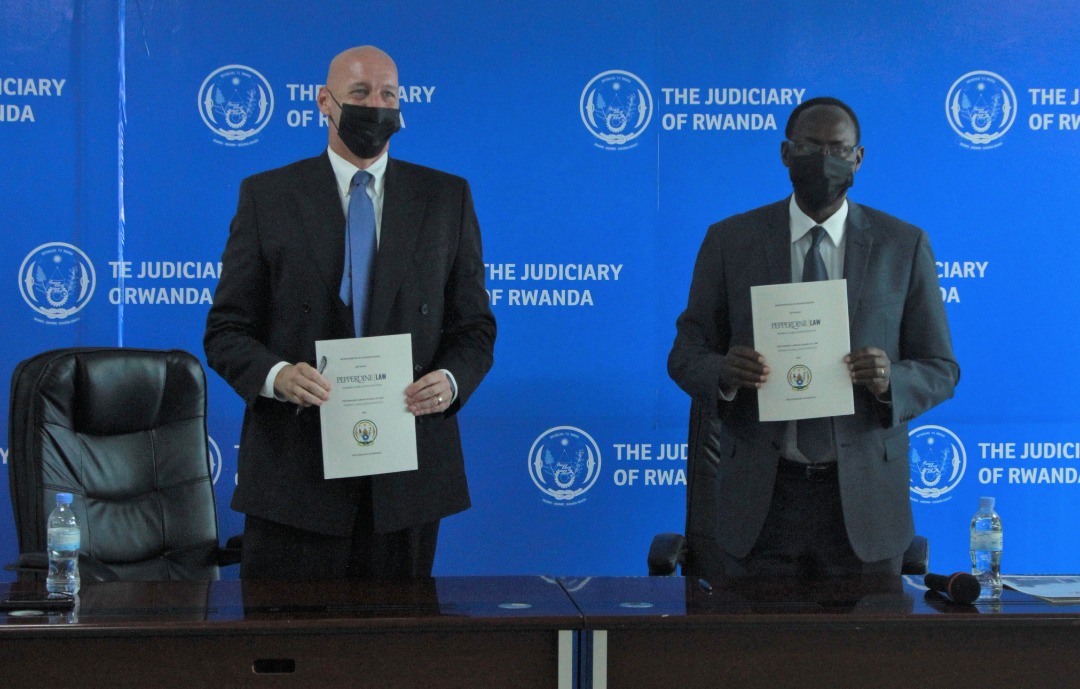 Chief Justice Faustin Ntezilyayo and Scott F. Leist, the East Africa Director of the Pepperdine Caruso School of Law during the signing at the Supreme Court on Wednesday, August 10. / Courtesy